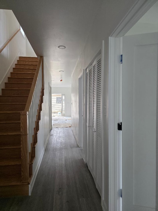 hallway featuring stairway and wood finished floors