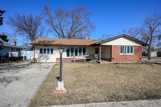 single story home featuring a front yard, fence, a chimney, crawl space, and brick siding