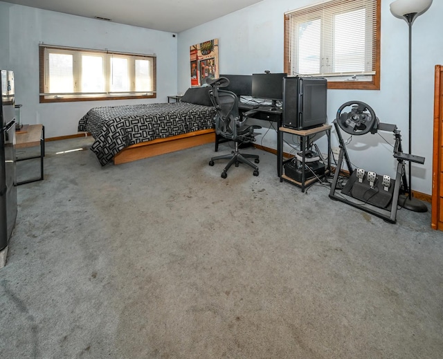 carpeted bedroom with visible vents and baseboards