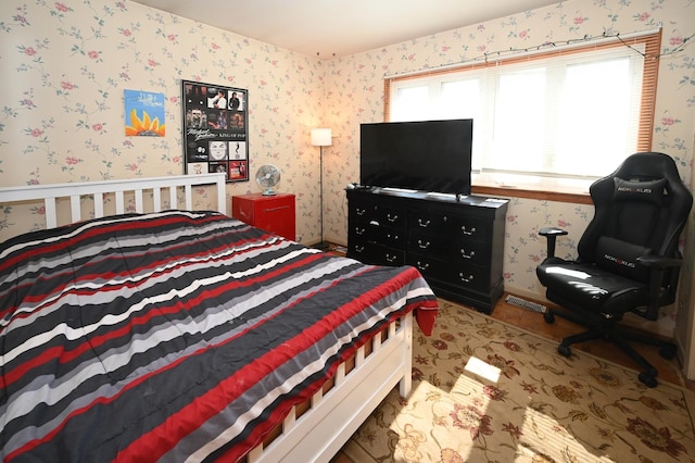 bedroom featuring wallpapered walls