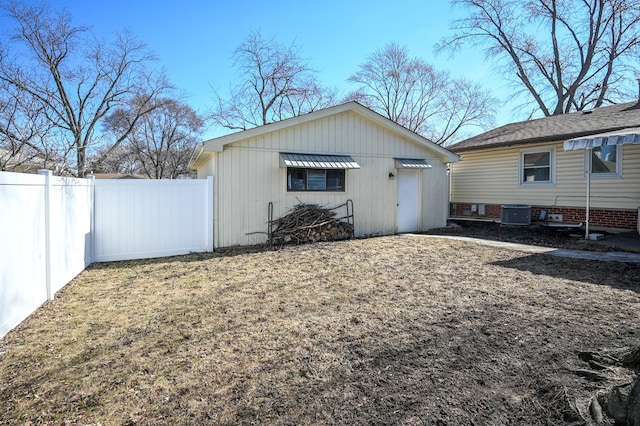 exterior space featuring cooling unit and fence