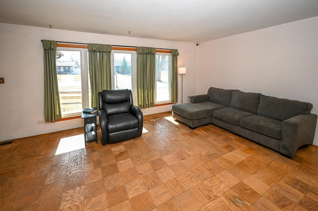 living room featuring baseboards