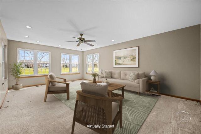 13731 S Tamarack Dr, Plainfield, IL 60544 - carpeted living room featuring baseboards, a ceiling fan, and recessed lighting