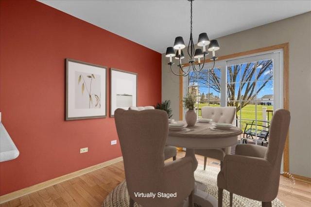 13731 S Tamarack Dr, Plainfield, IL 60544 - dining area with baseboards, a chandelier, and wood finished floors