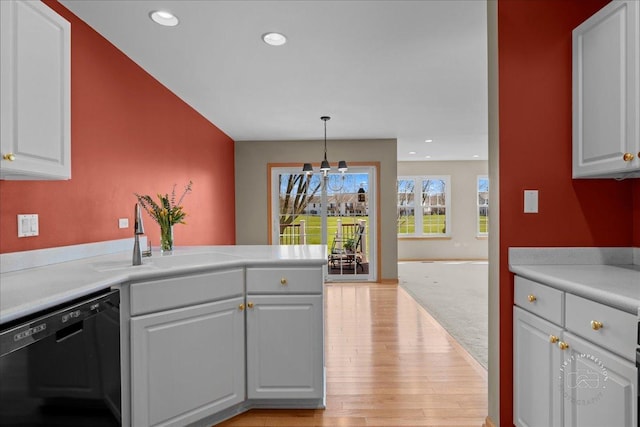 13731 S Tamarack Dr, Plainfield, IL 60544 - kitchen with a sink, dishwasher, light wood-style flooring, light countertops, and a notable chandelier