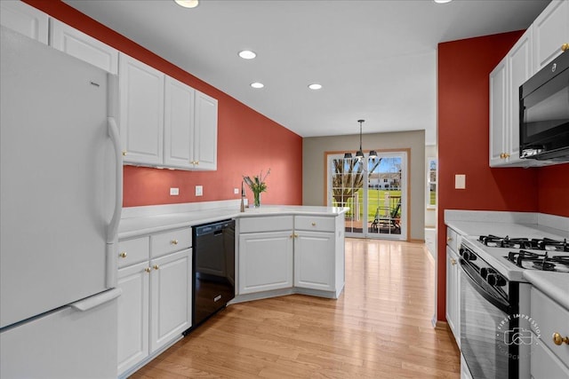 13731 S Tamarack Dr, Plainfield, IL 60544 - kitchen featuring light countertops, light wood-style floors, black appliances, and recessed lighting
