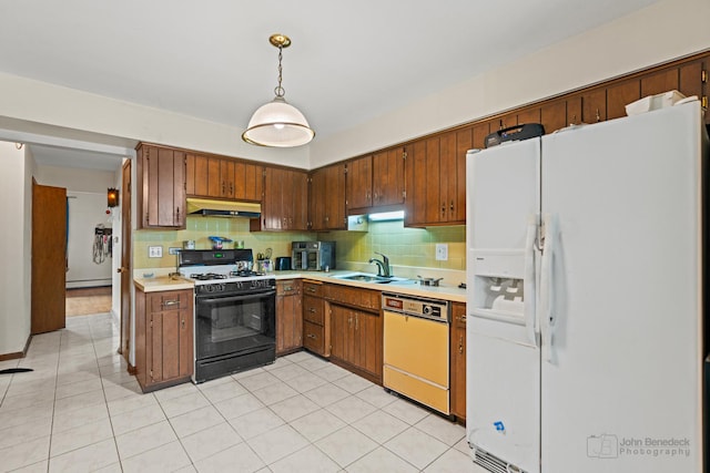 kitchen with light countertops, gas range, white fridge with ice dispenser, under cabinet range hood, and dishwashing machine