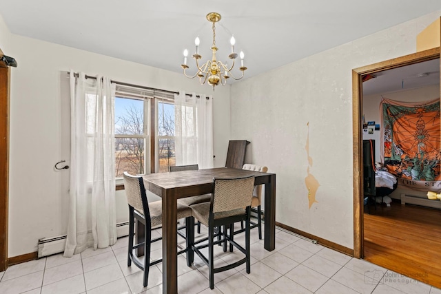 dining space featuring light tile patterned flooring, baseboards, baseboard heating, and an inviting chandelier