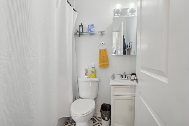 bathroom featuring a shower with curtain, toilet, and vanity