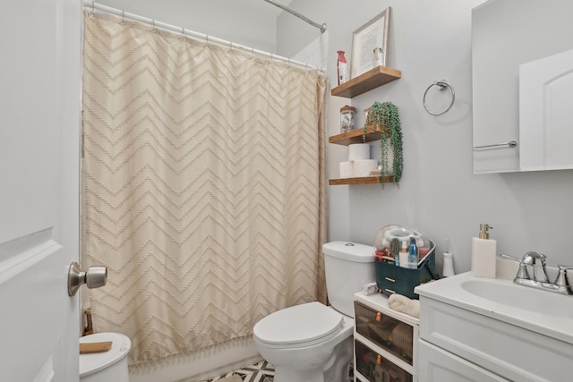 full bathroom featuring toilet and vanity