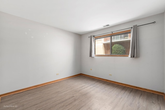 6453C N NW Hwy Unit 1S, Chicago, IL 60631 - spare room with wood finished floors and baseboards
