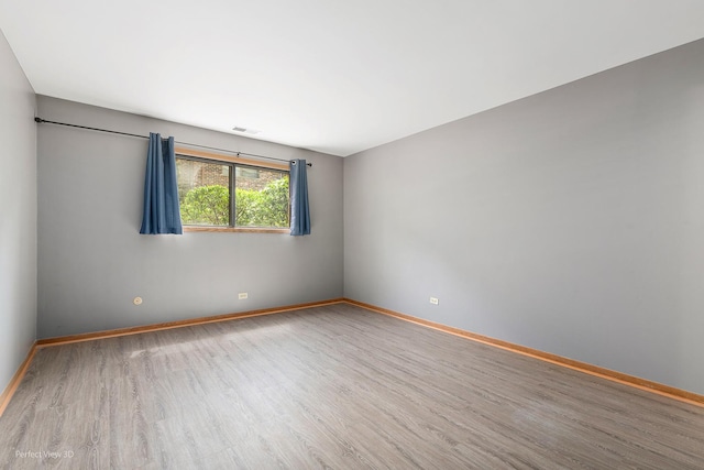 6453C N NW Hwy Unit 1S, Chicago, IL 60631 - spare room with wood finished floors and baseboards