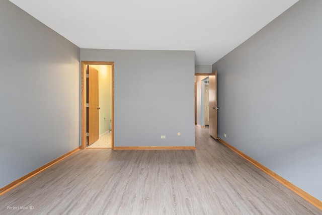 6453C N NW Hwy Unit 1S, Chicago, IL 60631 - spare room with wood finished floors and baseboards