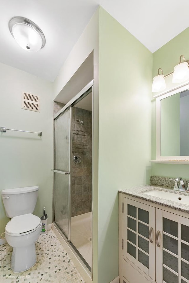 6453C N NW Hwy Unit 1S, Chicago, IL 60631 - bathroom with toilet, a shower stall, vanity, and baseboards