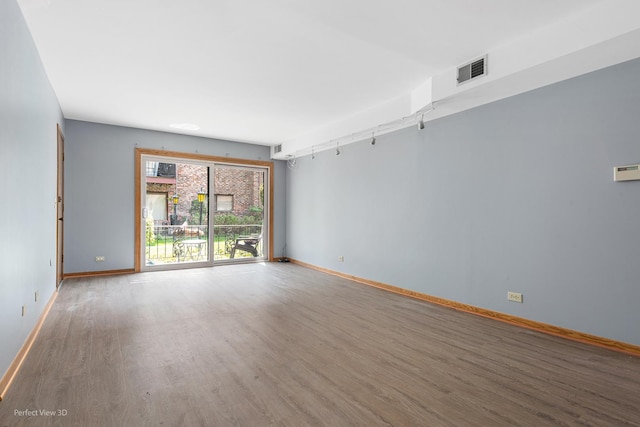 6453C N NW Hwy Unit 1S, Chicago, IL 60631 - empty room with wood finished floors and baseboards