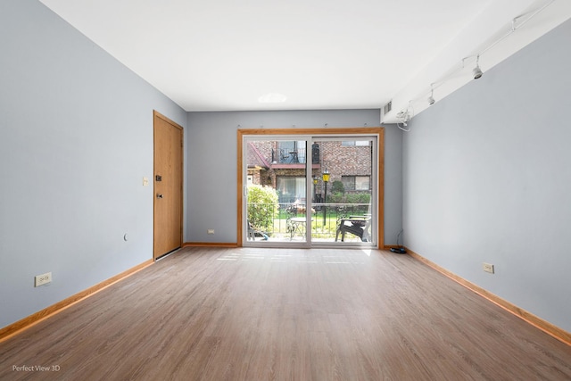 6453C N NW Hwy Unit 1S, Chicago, IL 60631 - empty room featuring wood finished floors and baseboards