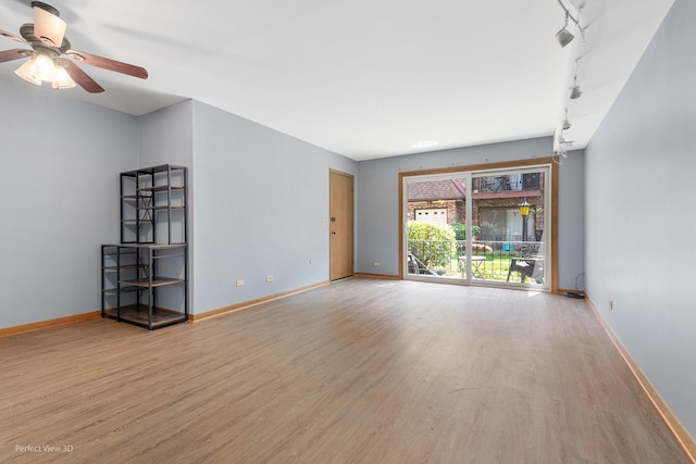 6453C N NW Hwy Unit 1S, Chicago, IL 60631 - spare room featuring wood finished floors, ceiling fan, and baseboards