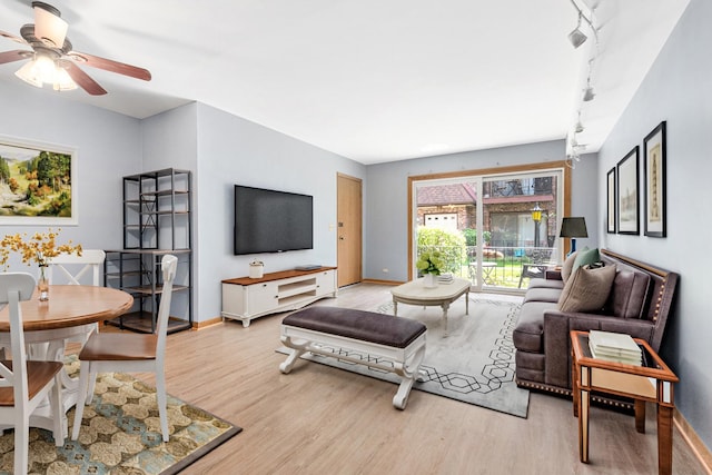 6453C N NW Hwy Unit 1S, Chicago, IL 60631 - living area with wood finished floors, a ceiling fan, baseboards, and track lighting