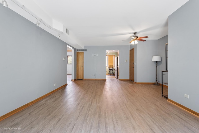 6453C N NW Hwy Unit 1S, Chicago, IL 60631 - unfurnished living room with ceiling fan, light wood finished floors, and baseboards