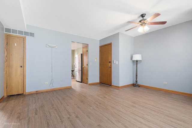 6453C N NW Hwy Unit 1S, Chicago, IL 60631 - unfurnished room with light wood-style flooring, a ceiling fan, and baseboards