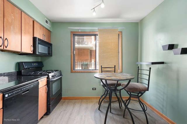 6453C N NW Hwy Unit 1S, Chicago, IL 60631 - kitchen with black appliances, light wood-style floors, baseboards, dark countertops, and brown cabinets