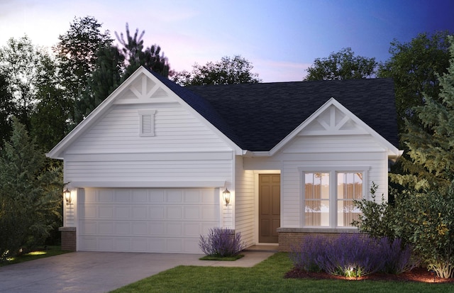 view of front of house with a shingled roof, brick siding, driveway, and an attached garage