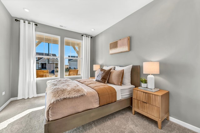 bedroom with recessed lighting, light carpet, visible vents, and baseboards