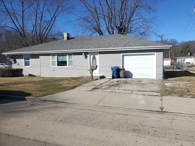 ranch-style house with a garage, driveway, roof with shingles, and a front yard