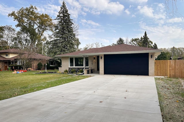 ranch-style house featuring a garage, concrete driveway, a front lawn, and brick siding