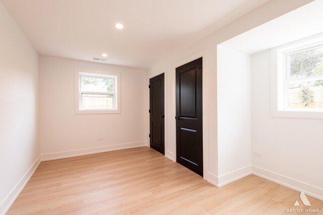 unfurnished bedroom featuring light wood-style floors, recessed lighting, visible vents, and baseboards