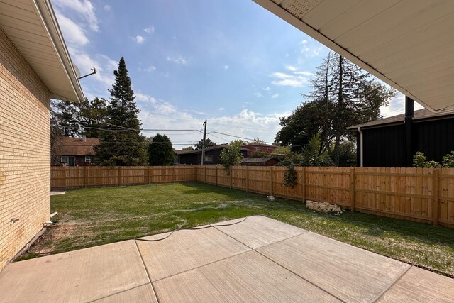 exterior space with a fenced backyard