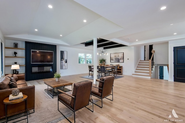 living room featuring light wood-style flooring, stairway, baseboards, and recessed lighting