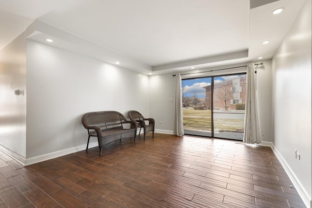 living area with recessed lighting, baseboards, and dark wood finished floors