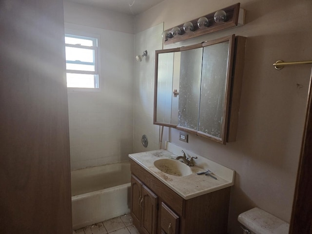 full bathroom featuring toilet, tile patterned floors, bathing tub / shower combination, and vanity