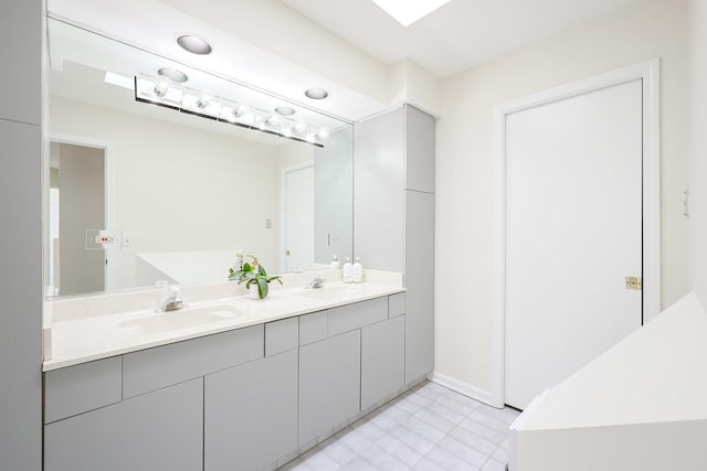 bathroom featuring double vanity and a sink