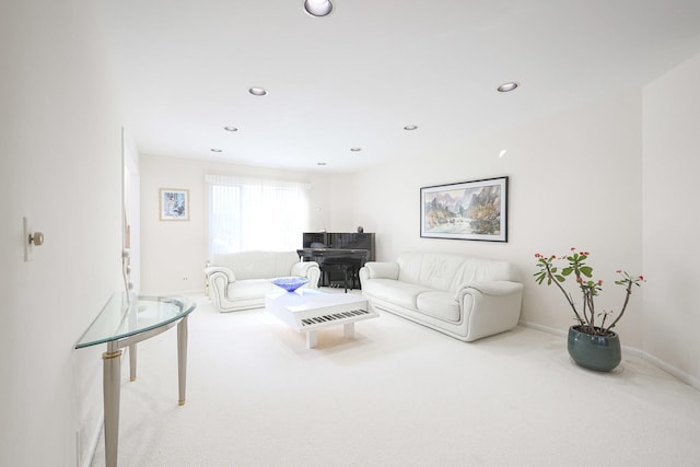 carpeted living room featuring recessed lighting and baseboards