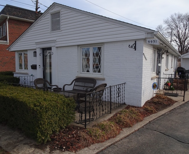 view of home's exterior featuring brick siding