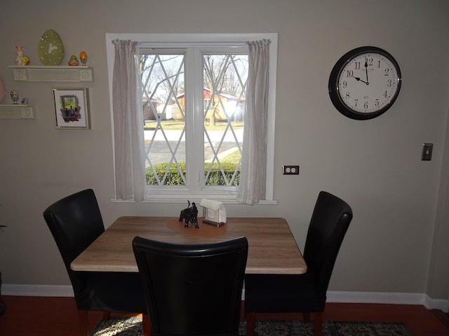 dining space featuring baseboards