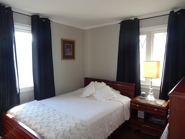 bedroom with ornamental molding