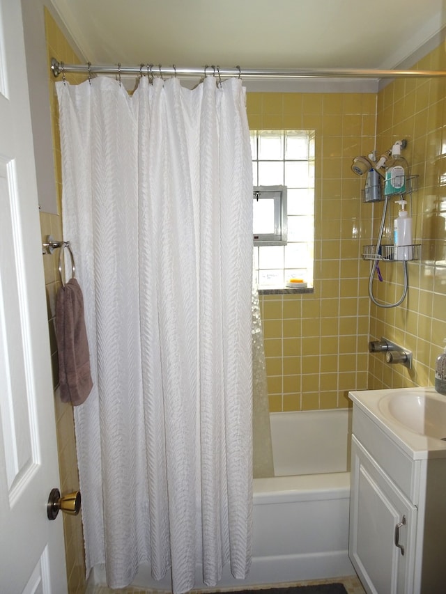 full bathroom featuring vanity and shower / bath combination with curtain