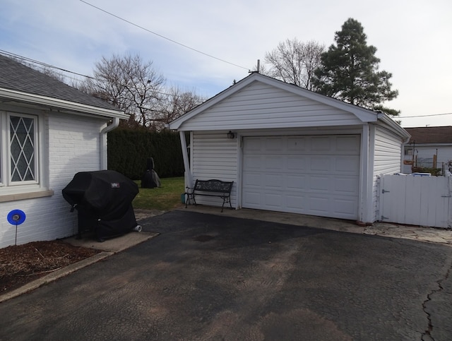 detached garage with aphalt driveway