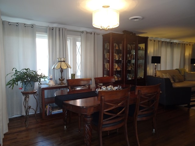 dining area featuring wood finished floors and visible vents