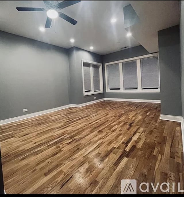 unfurnished room featuring recessed lighting, wood finished floors, a ceiling fan, and baseboards