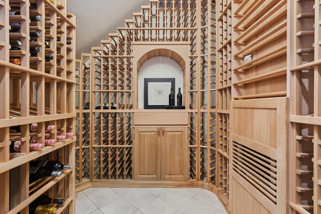 wine area featuring light tile patterned floors