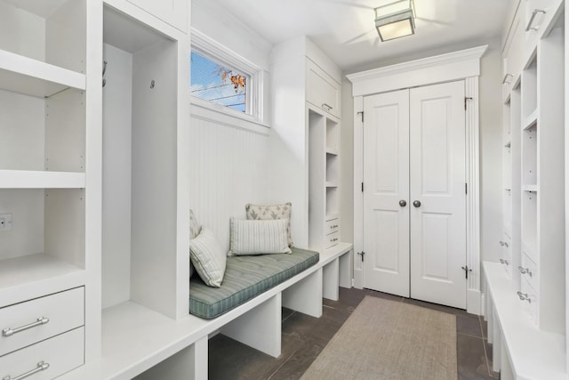 mudroom with dark wood-style floors