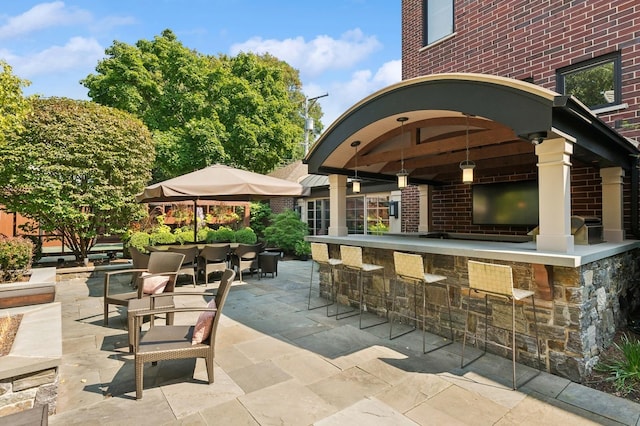 view of patio featuring outdoor dry bar