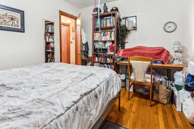 bedroom featuring wood finished floors