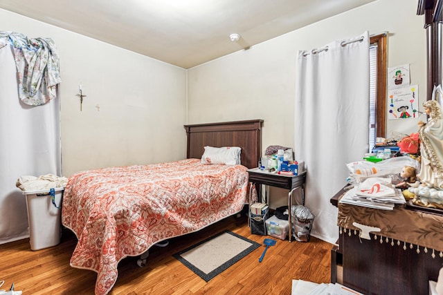 bedroom with wood finished floors