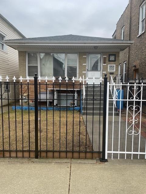 view of gate featuring a fenced front yard