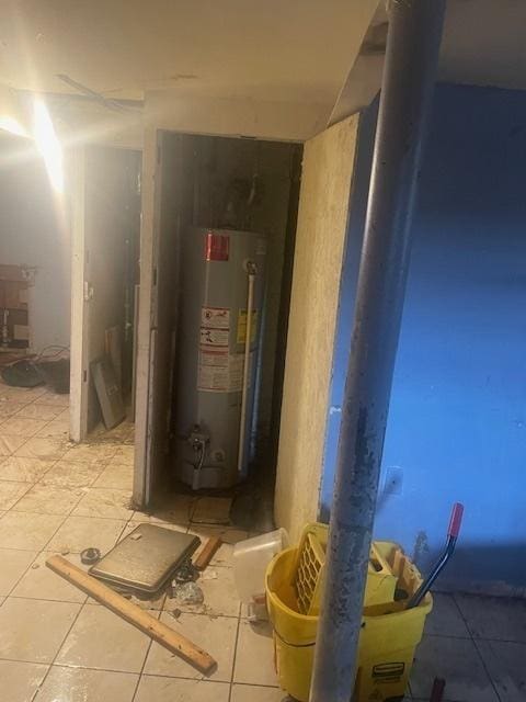 utility room with water heater